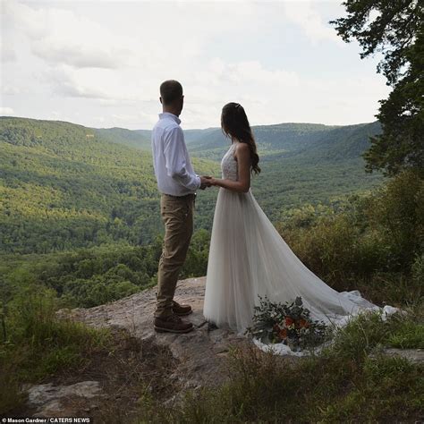 Adventure Loving Couple Pose For Wedding Photos On The Edge Of A Cliff