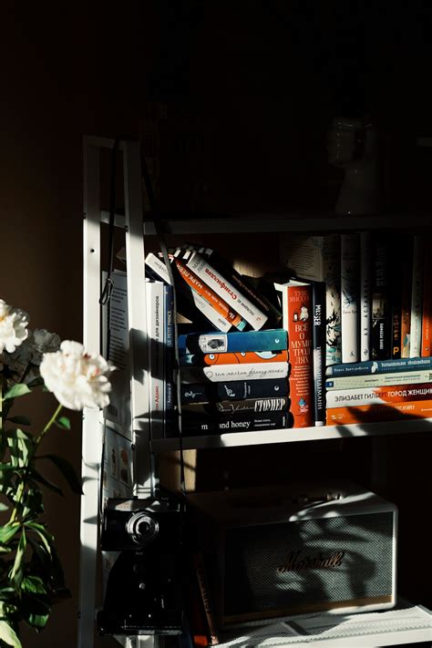 Books On Black Wooden Shelf Photo Free Indoors Image On Unsplash