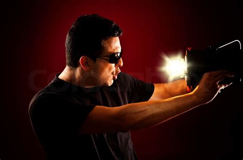 Man Holding A Light In Front Of His Face Stock Image Colourbox