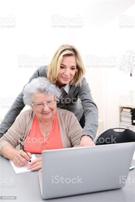 Attractive 40 Years Old Woman Helping With Computer Her Mother For