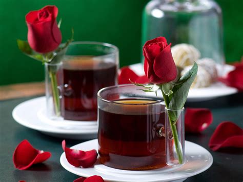 Download Beautiful Cup Of Tea With Roses Wallpaper