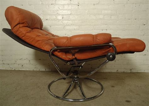 The tori chair with its tall back clean lines blends transitional styling with lots of comfort. Mid-Century Reclining Chair and Ottoman by Ekornes Stressless at 1stdibs