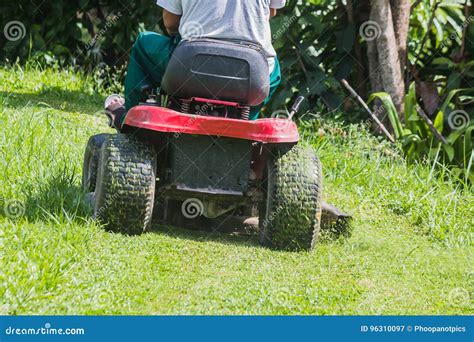 The Gardener Is Using A Lawn Mower Stock Image Image Of Gardener