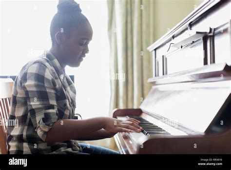 Teenage Girl Playing Piano Stock Photo Alamy