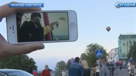 Russia Bishop Blesses City From Hot Air Balloon Bbc News
