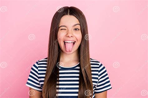 Photo Of Pretty Funny Impressed Girl Wear Striped Outfit Winking Showing Tongue Isolated Pink