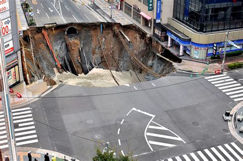 Look Giant Sinkhole Swallows Japan City Street Abs Cbn News
