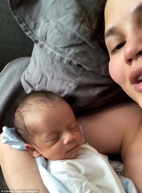 Chrissy Teigen Cuddles With Newborn Son Miles In Bed Daily Mail Online