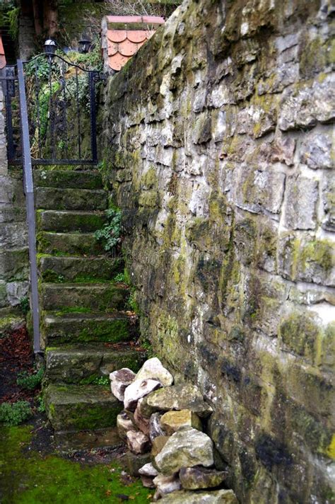 Ancient Garden Access From Stone Staircase And Natural Stone Wall With