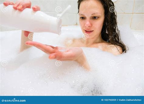 Brunette Woman Pouring Shampoo On Hand In Shower Stock Image Image Of