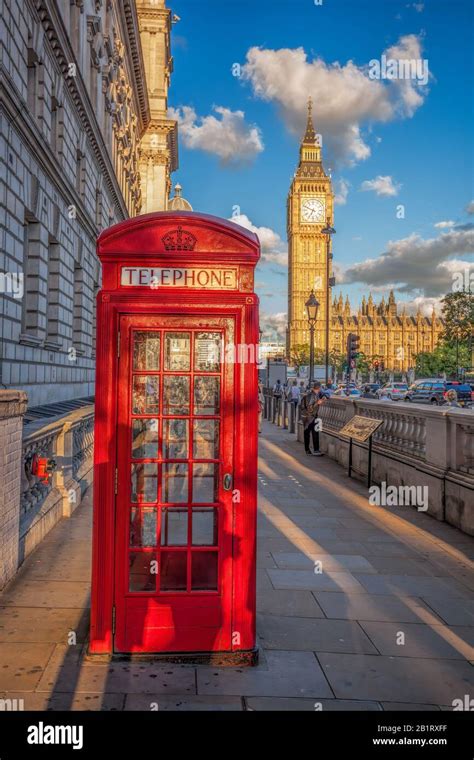 London With Red Phone Booth Against Big Ben In England Uk Stock Photo