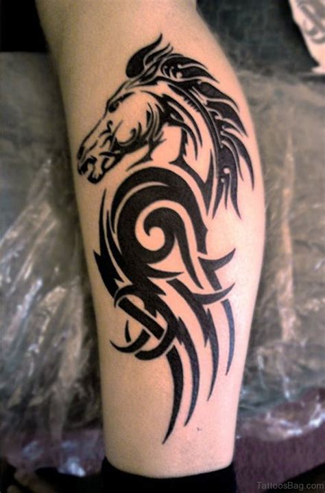 Majestic looking brown horses done on woman's thigh. 108 Great Looking Tribal Tattoos On Leg