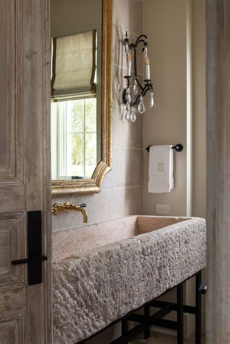 Powder Room With Antique French Limestone Trough Sink Brass Faucet