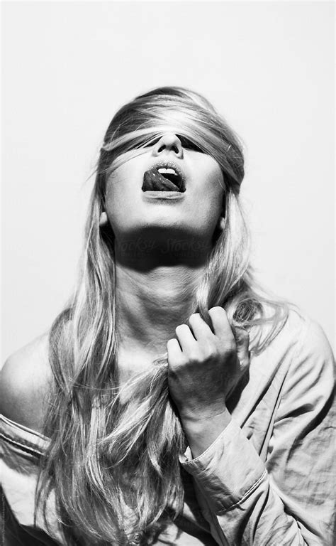 Hip Blonde Female With Her Hair Over Faceconceptual Black And White Portrait By Stocksy