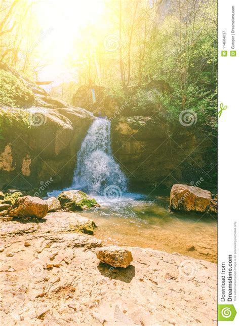 Waterfall On A Mountain River In The Forest On A Balmy