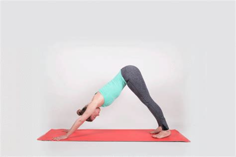 A Woman Is Doing A Yoga Pose On A Red Mat