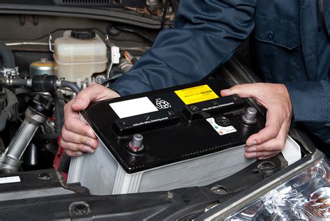 Auto Mechanic Replacing Car Battery Waynes Mechanical World