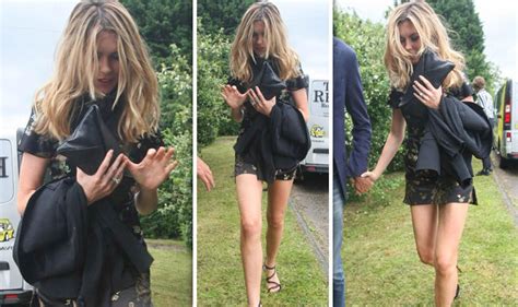 Abbey Clancy Puts On A Very Leggy Display In Thigh Skimming Dress