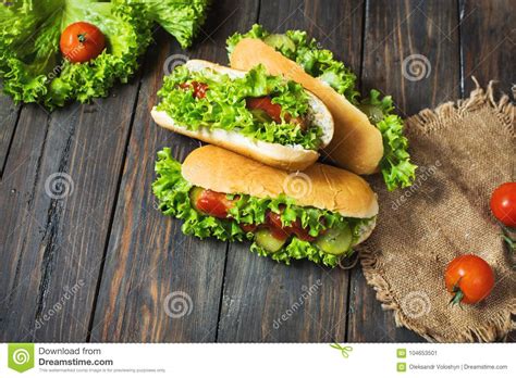 Hot Dog With Pickles And Lettuce On Wood Background Stock Image Image