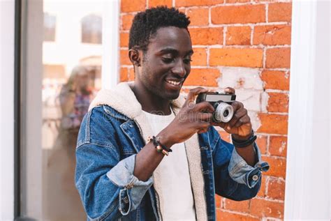 Portrait Happy Smiling African Man Photographer With Vintage Film