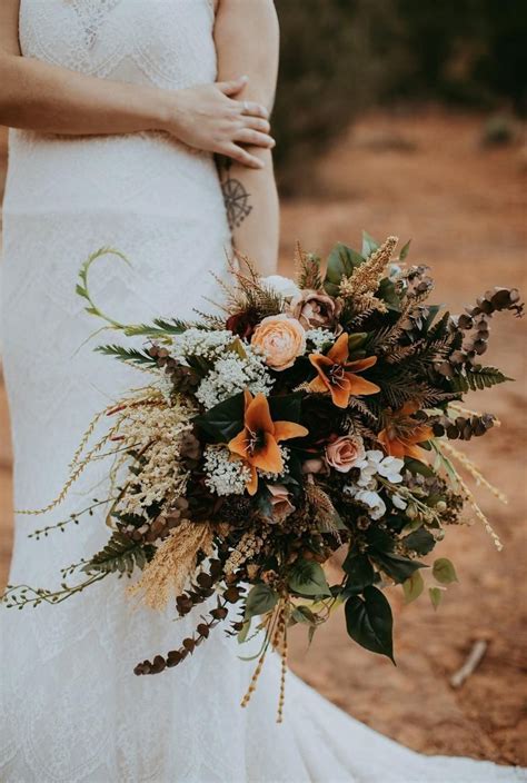Beautiful flowers make the wedding, and even small weddings depend on arranging just the right mix of blooms and greenery. Fall bridal bouquet, autumn bridal bouquet, wedding ...