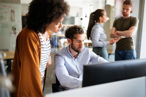 Software Engineers Working On Project And Programming In Company Stock