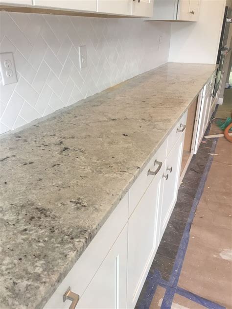 This stone is especially good for counter tops and bar tops, interior wall panels,monuments, stairs, pavers, pool copings, water walls. Cotton White Granite Slab | White granite countertops ...
