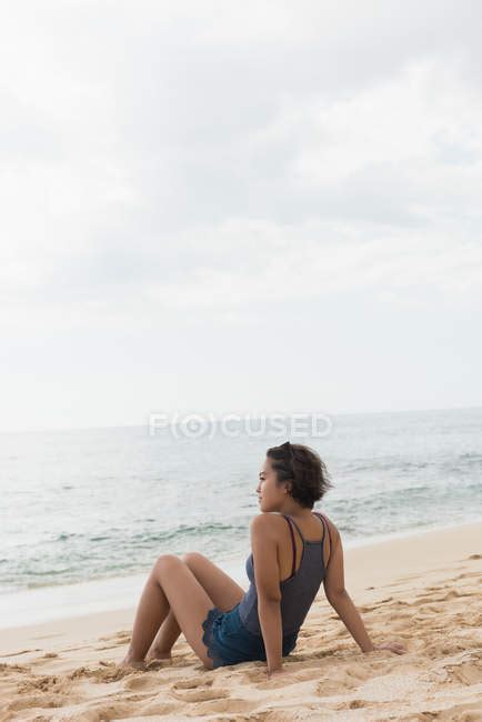 Woman Relaxing In The Beach On A Sunny Day Solitude Vacation Stock