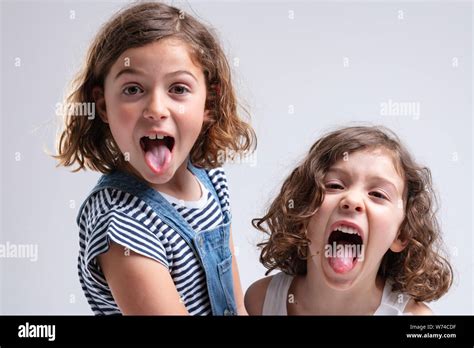 Two Girls Sticking Tongues Out Hi Res Stock Photography And Images Alamy