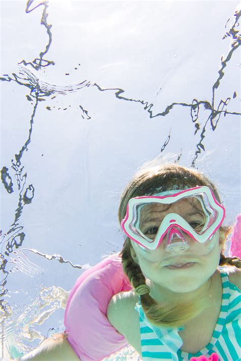 Young Girl Playing In The Pool In Summer Time By Stocksy Contributor Skc Stocksy