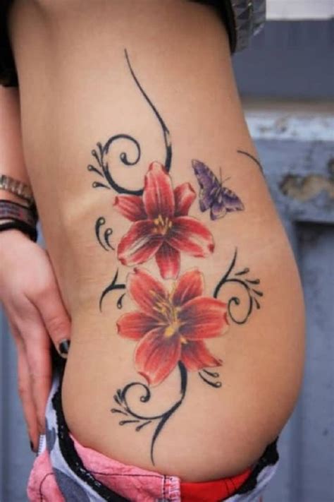 If you want to get used to the pain of the tattoo gun a simple red heart is a symbol of love and passion. Red Ink 3D Flower And Butterfly Tattoo On Girl Rib Side ...
