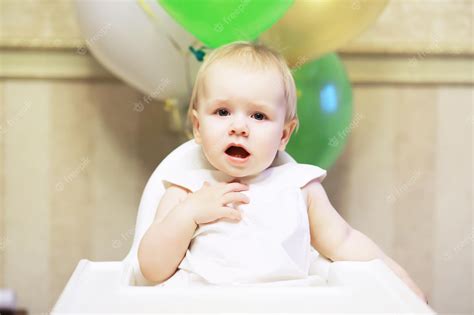 Premium Photo Birthday One Year Old Girl With Baloons