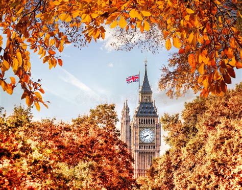 Big Ben Clock Against Autumn Leaves In London England Uk Stock Image