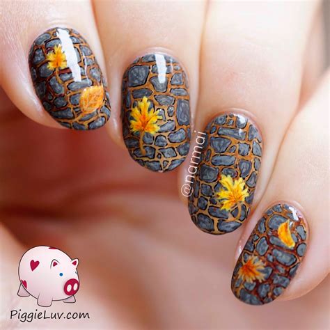 This season rich color palettes meet sleek minimalist details for designs you can even master yourself at home, if you choose. PiggieLuv: Freehand fall garden path nail art