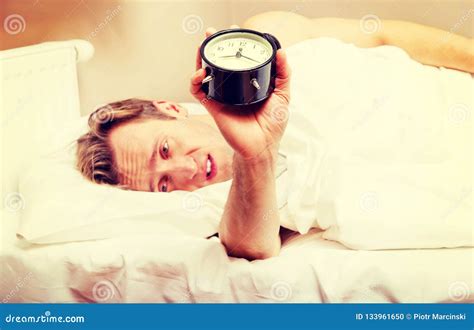 Man Trying To Sleep When Alarm Clock Ringing Stock Photo Image Of