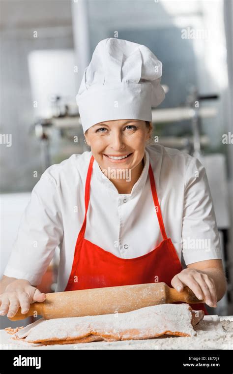 Happy Chef Rolling Pasta Sheet At Counter Stock Photo Alamy