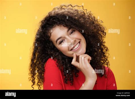 Close Up Shot Of Charming Flirty And Silly Curly Haired Young Woman