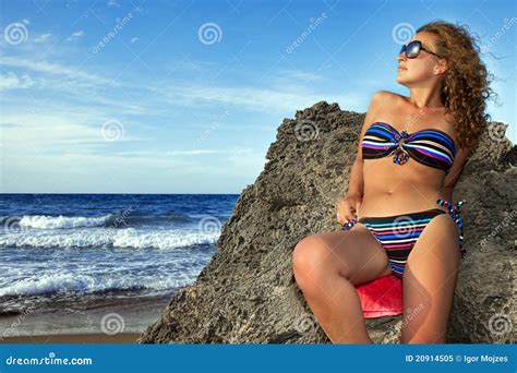 Woman Sitting On The Rocks Stock Image Image Of Blue
