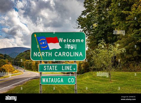 A Welcome To North Carolina Sign On The Highway Marking The State