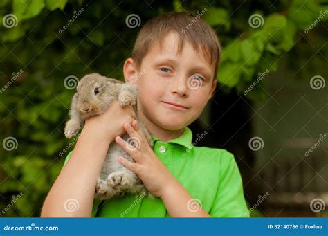 The Little Boy With A Rabbit In The Hands Stock Photo Image Of Loving
