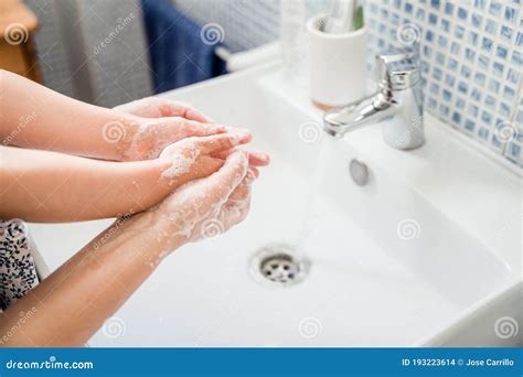 Mother And Child Wash Hands With Soap In Washbasin Stock Photo Image