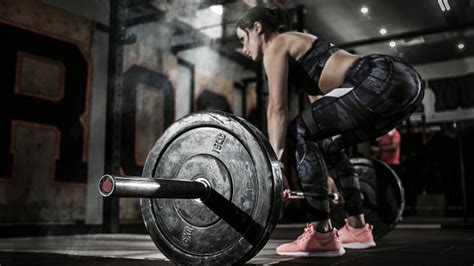Sport Muscular Women Lifting Deadlift In The Gym With Barbell Dramatic