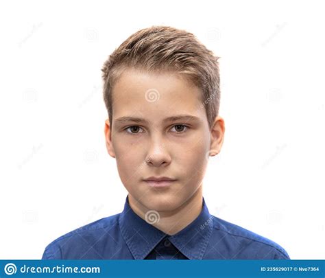 Head And Shoulders Portrait Of A Young 11 Year Old Boy With Brown Eyes