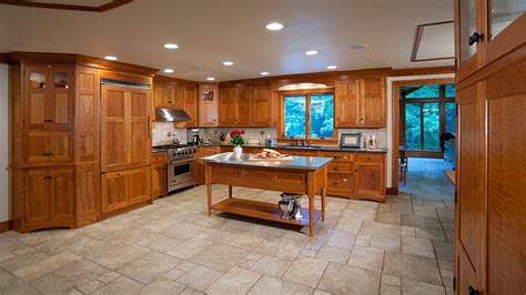 Brazilian walnut colored or cherry rich hardwood floors when paired with a light grain hardwood such as maple or hickory lighten the atmosphere. cherry cabinets, travertine floors | ... Cherry Wood ...