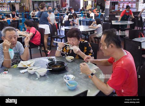 Malaysia, Penang, Georgetown, food court, people, eating Stock Photo