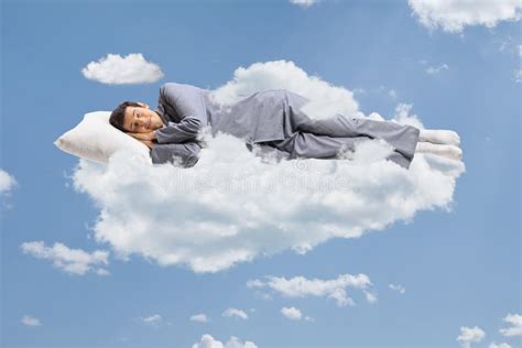 Man In Pajamas Sleeping On Cloud And Floating Stock Photo Image Of