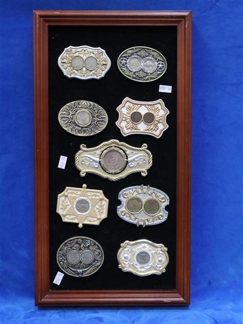 Lot 9 Framed Novelty Belt Buckles