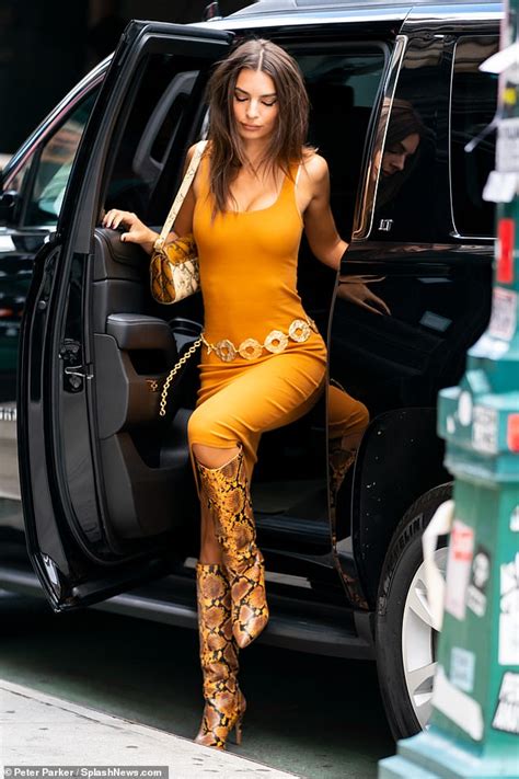 Emily Ratajkowski Hits The Streets In A Skin Tight Orange Dress As She