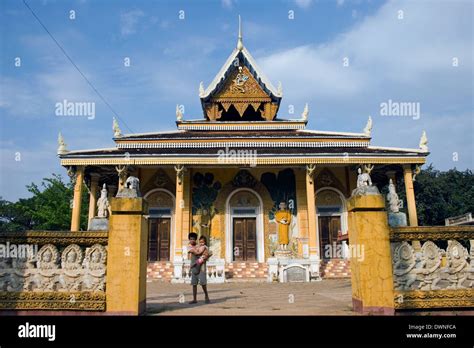 Two Children Are Standing In Front Of A Beautiful Buddhist Pagoda At