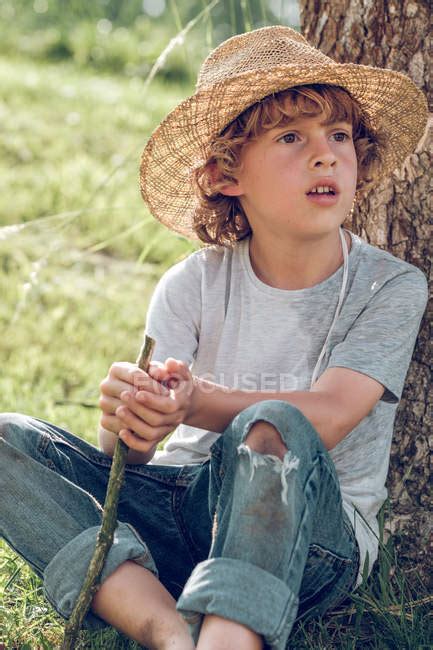 However, one tweet still on his. Barefoot boy sitting under tree — little boy, looking away ...